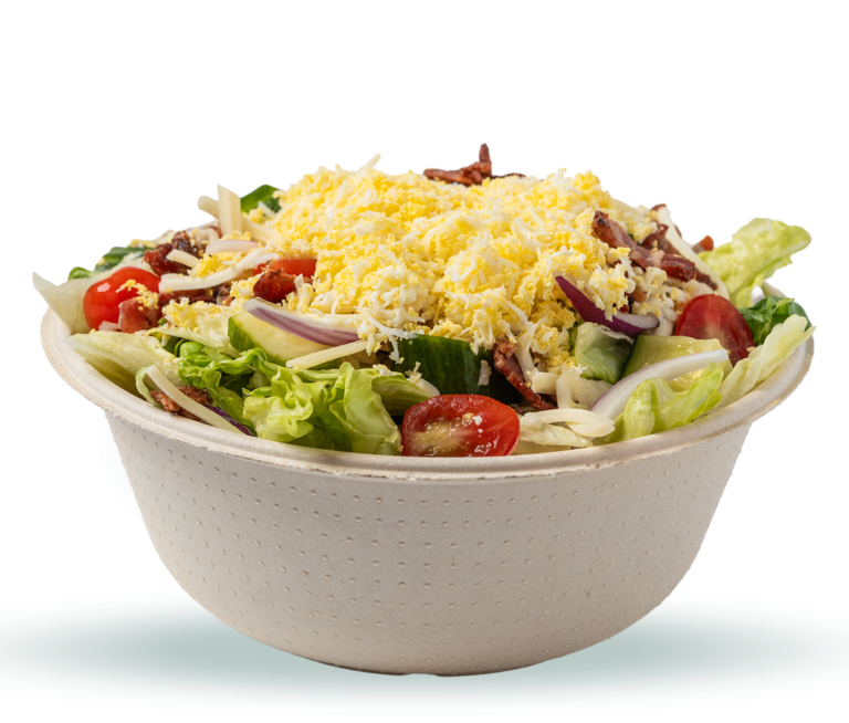 Rev Burger Cobb salad with tomato, applewood bacon, cucumber, red onion, Monterey Jack cheese, hard-boiled egg, and iceberg lettuce in a to-go bowl