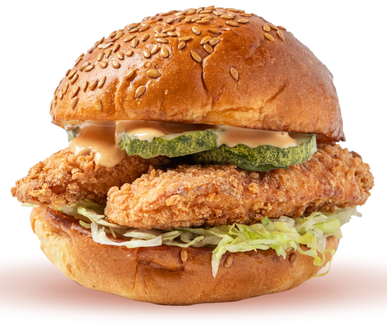 Rev Burger REV Bird sandwich with crispy fried chicken, lettuce, Grillo's pickles, and Lightning Sauce on a flax seed bun